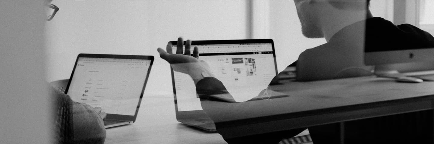 Colleagues working at laptops