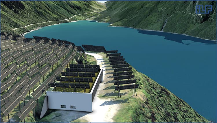 Hillside solar power plant near a lake, with rows of solar panels and a white building, surrounded by green hills and mountains.