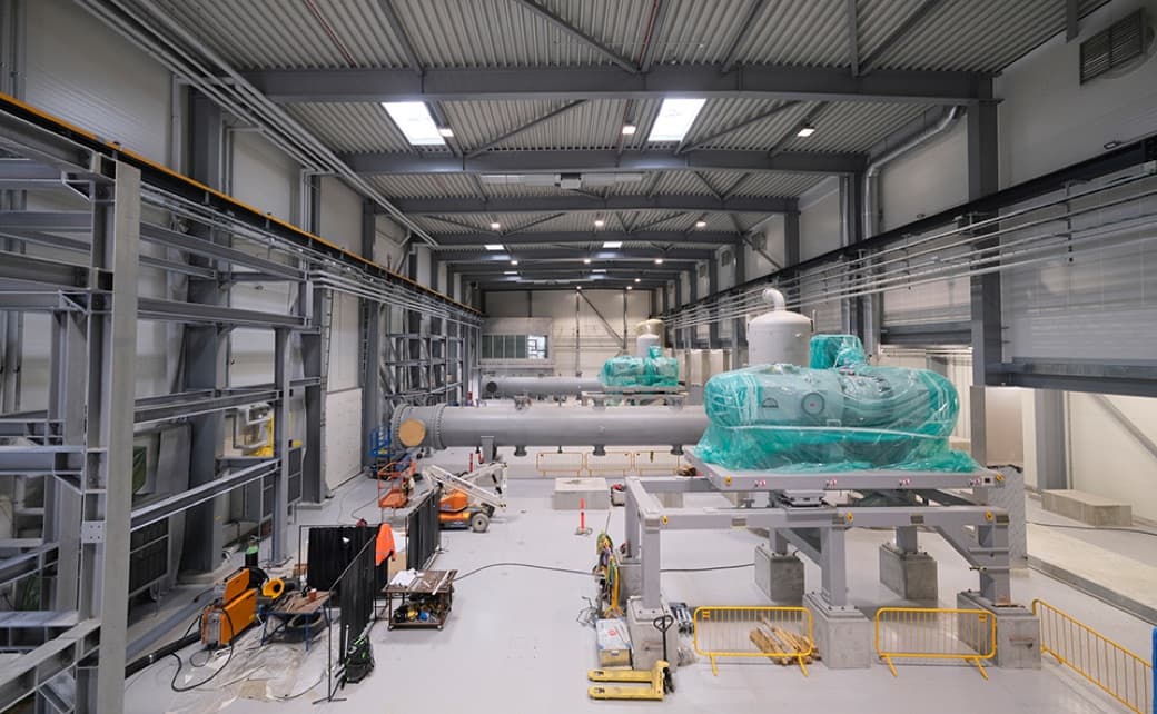 Workers in the Esbjerg heat pump hall